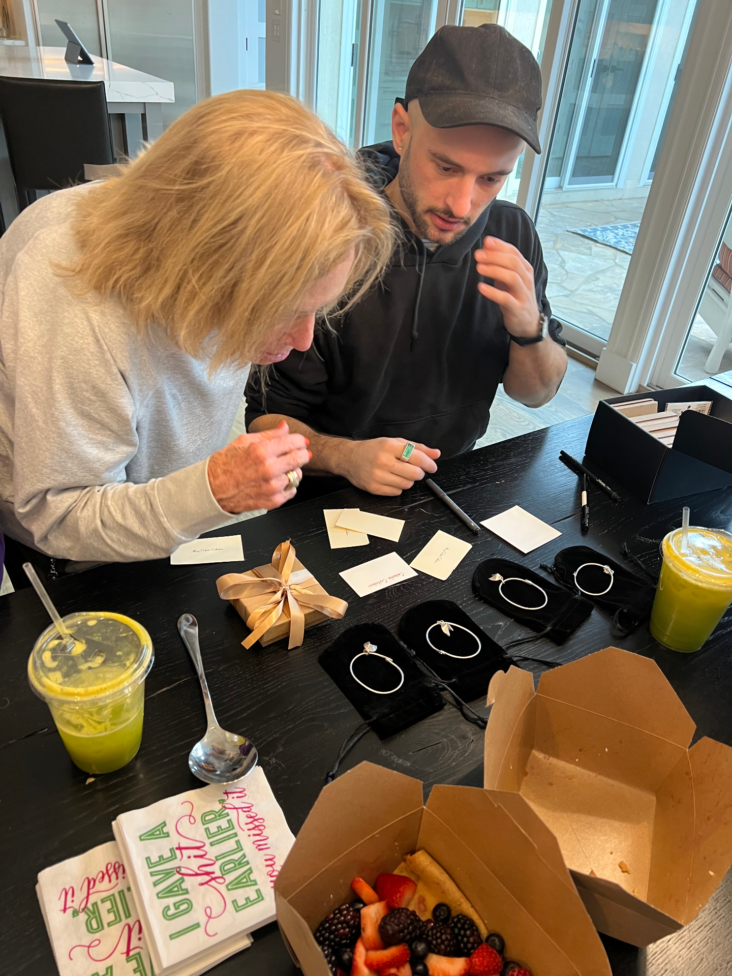 Dayne sharing a tray of gemstones during a behind-the-scenes consultation moment