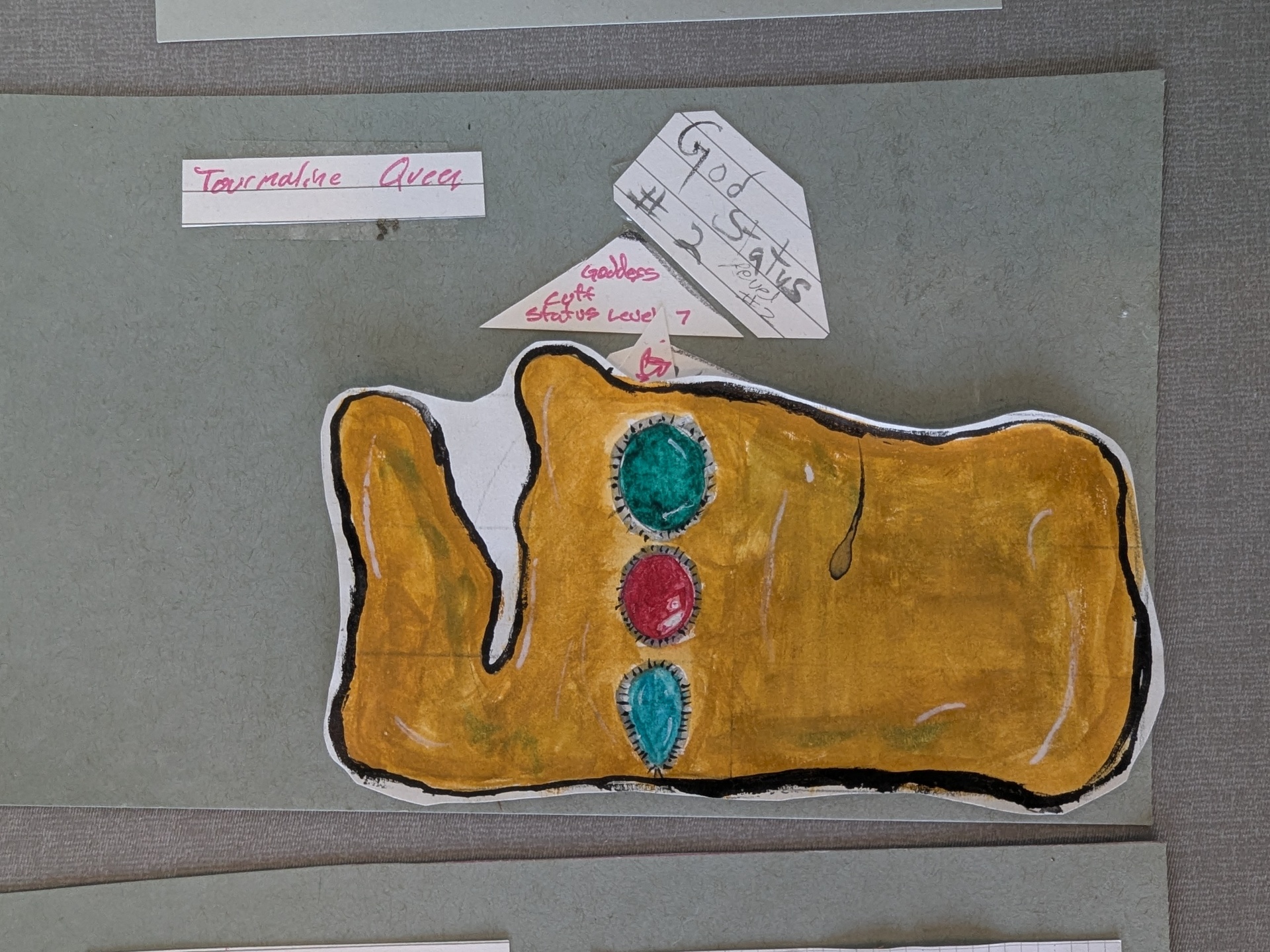 Tourmaline Queen — God Status #2 Goddess Cuff painted in gold with green, red, and teal stones