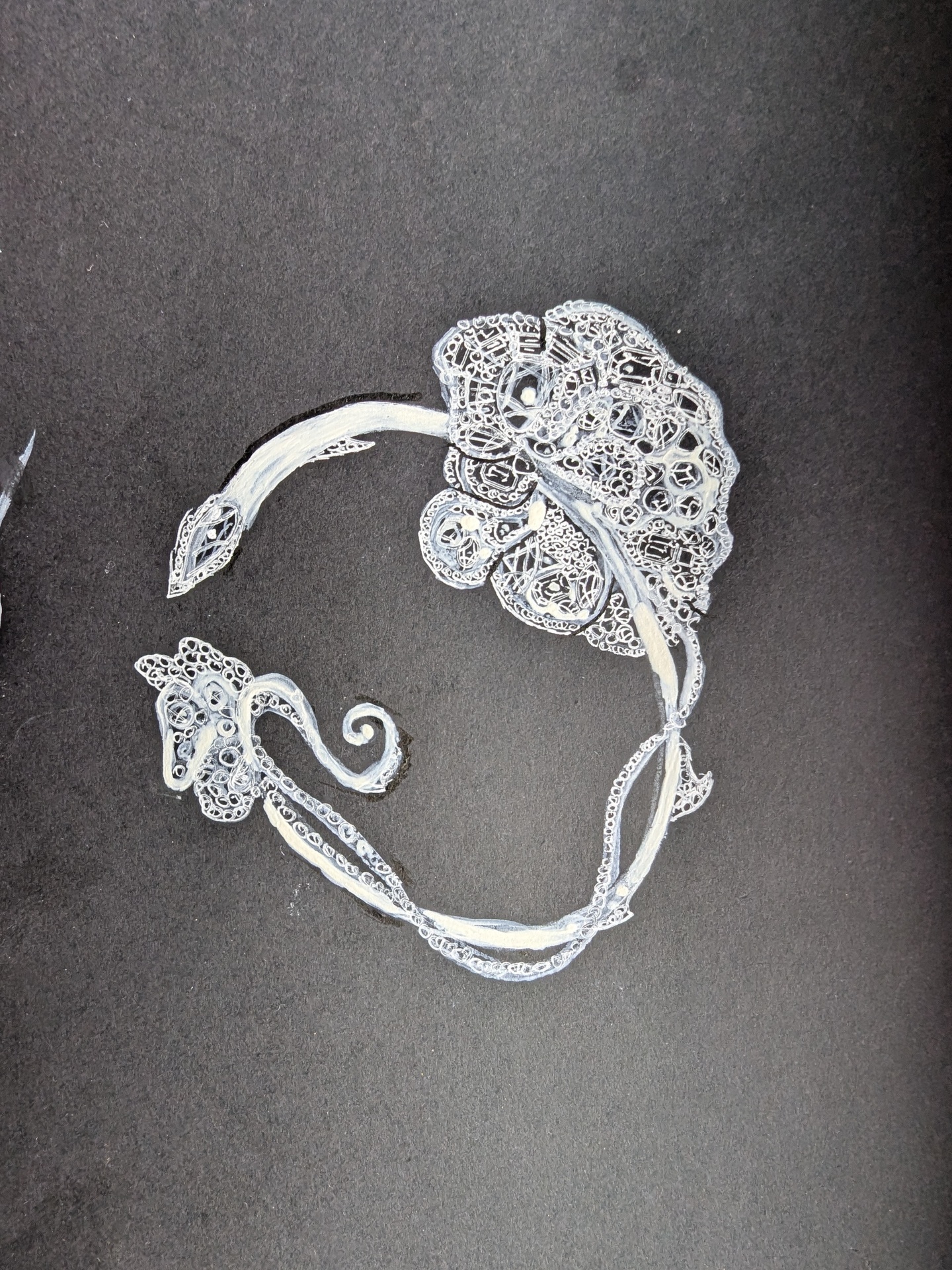 Detail sketch of an ornate filigree cuff bracelet in white on black